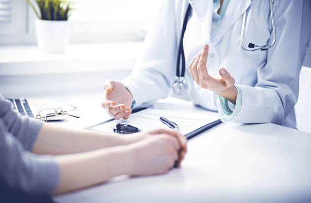 Doctor is asking health history of patient
